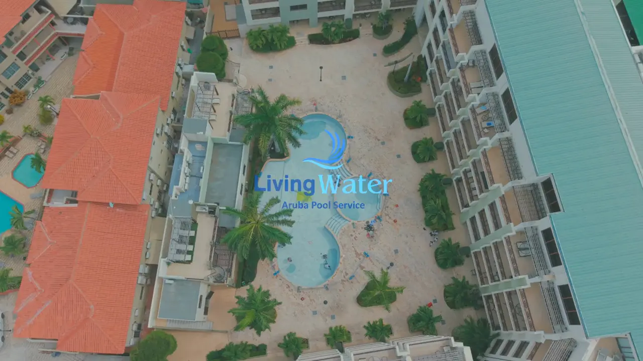 Living Water Aruba technician working on the tile of a pool during a renovation